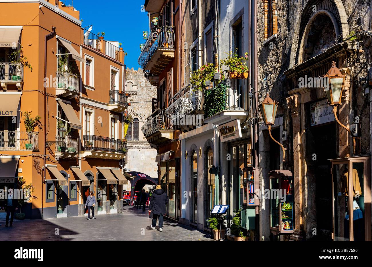 Taormina, Sicily, Italy - February 15, 2023: Historic old town quarter with traditional houses at Corso Umberto I main street of Taormina in Messina r Stock Photo