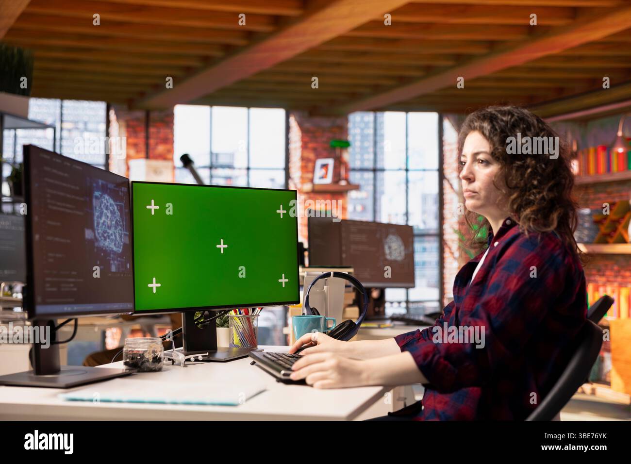 System administrator using isolated screen PC working with artificial intelligence technology in tech startup. Mockup computer display used by IT expert developing AI systems in tech startup Stock Photo