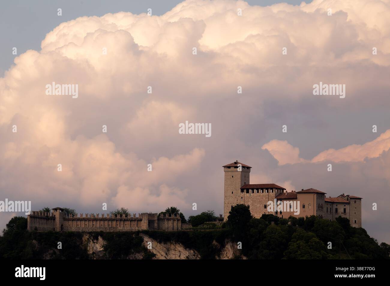Historic Castle with Tower Overlooking Dramatic Sky and Lush Greenery ...