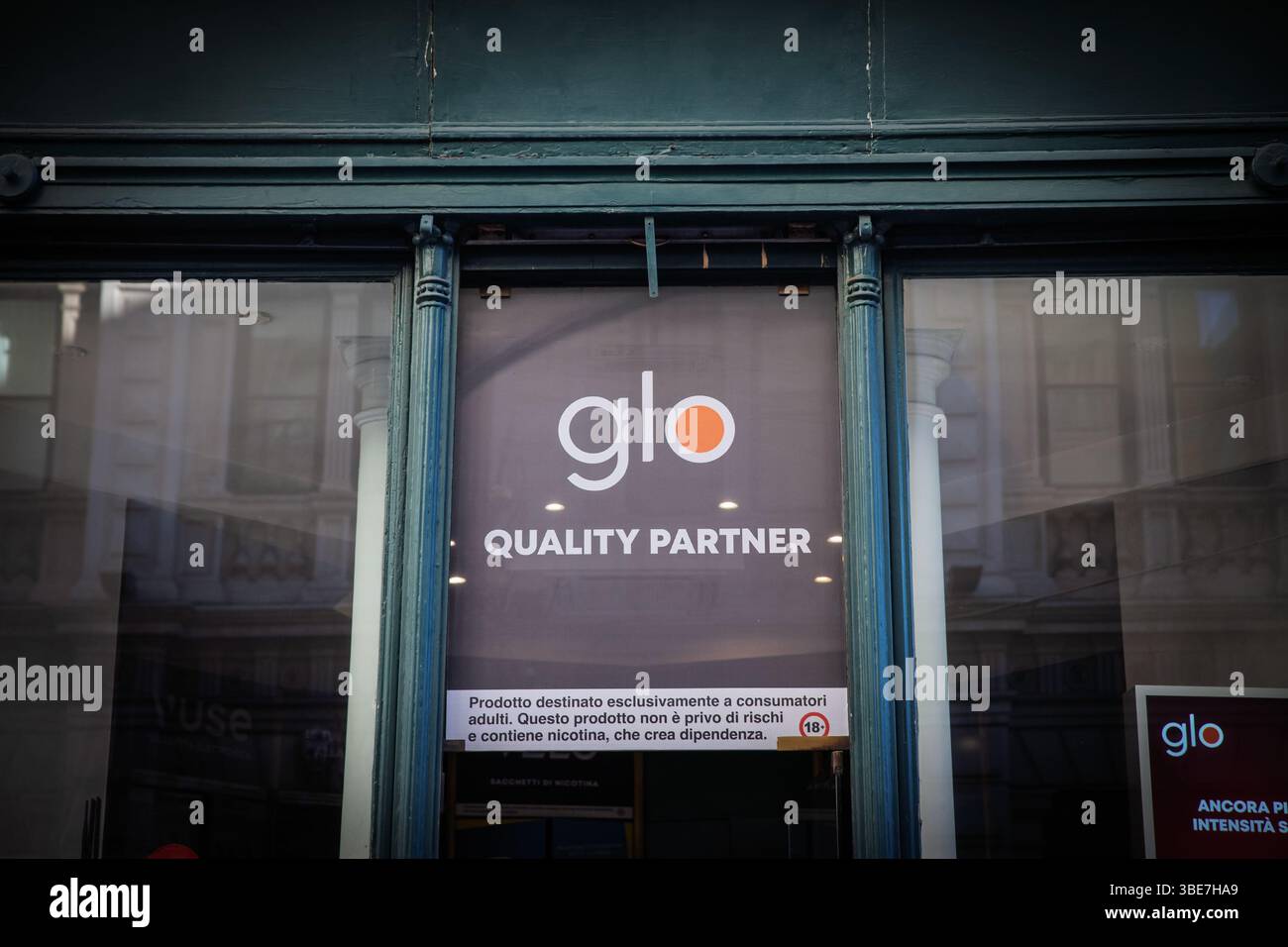 british american tobacco italy TRIESTE, ITALY - DECEMBER 17, 2024: Glo logo in front of a local shop in  Trieste, Italy. Glo, beloning to British American Tobacco is a tobacco  heatin Stock Photo