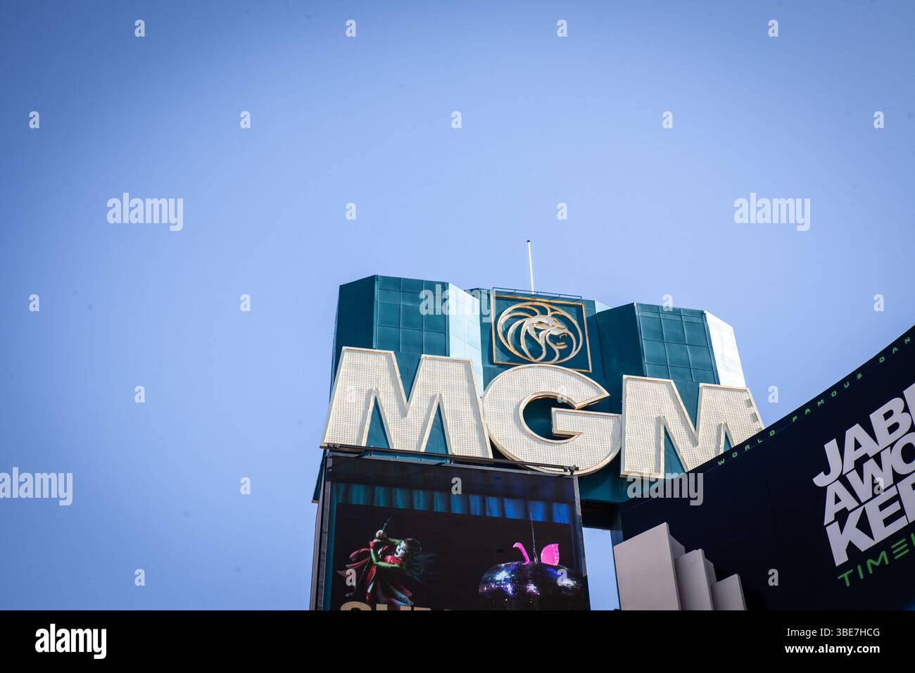 LAS VEGAS, AUGUST 21, 2024: MGM letters and lion emblem atop the teal glass tower of MGM Grand resort-casino on the Las Vegas Strip, Nevada. MGM Resor Stock Photo