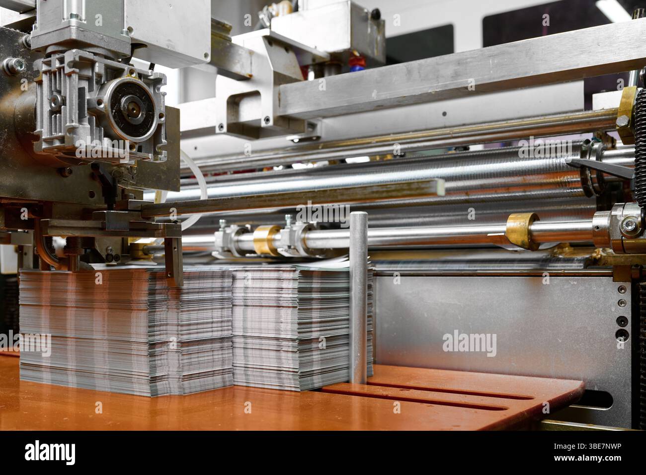 Advanced paper feed mechanism operates glue spreading machine in a ...