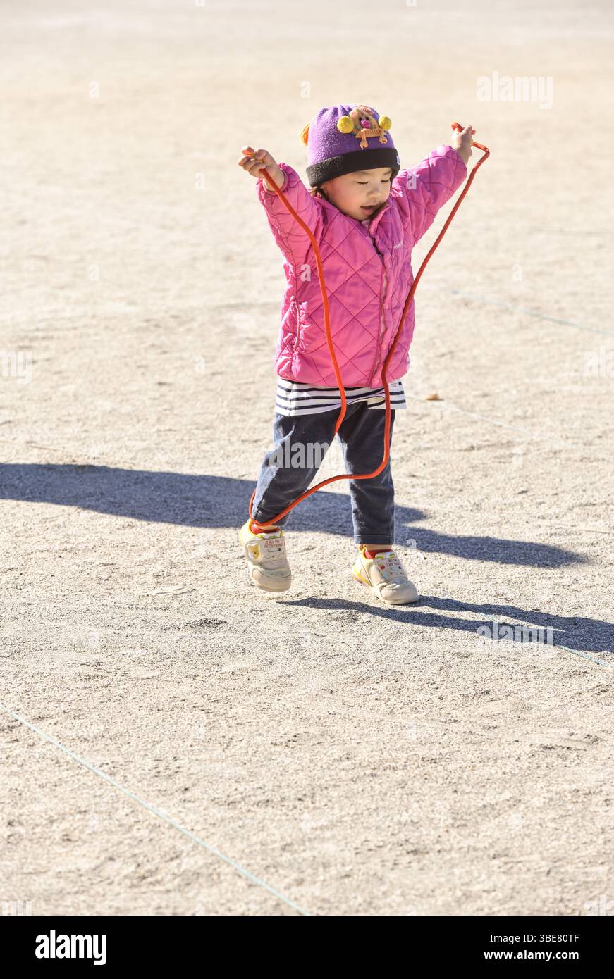 Girl playing with a jump rope hi-res stock photography and images - Alamy