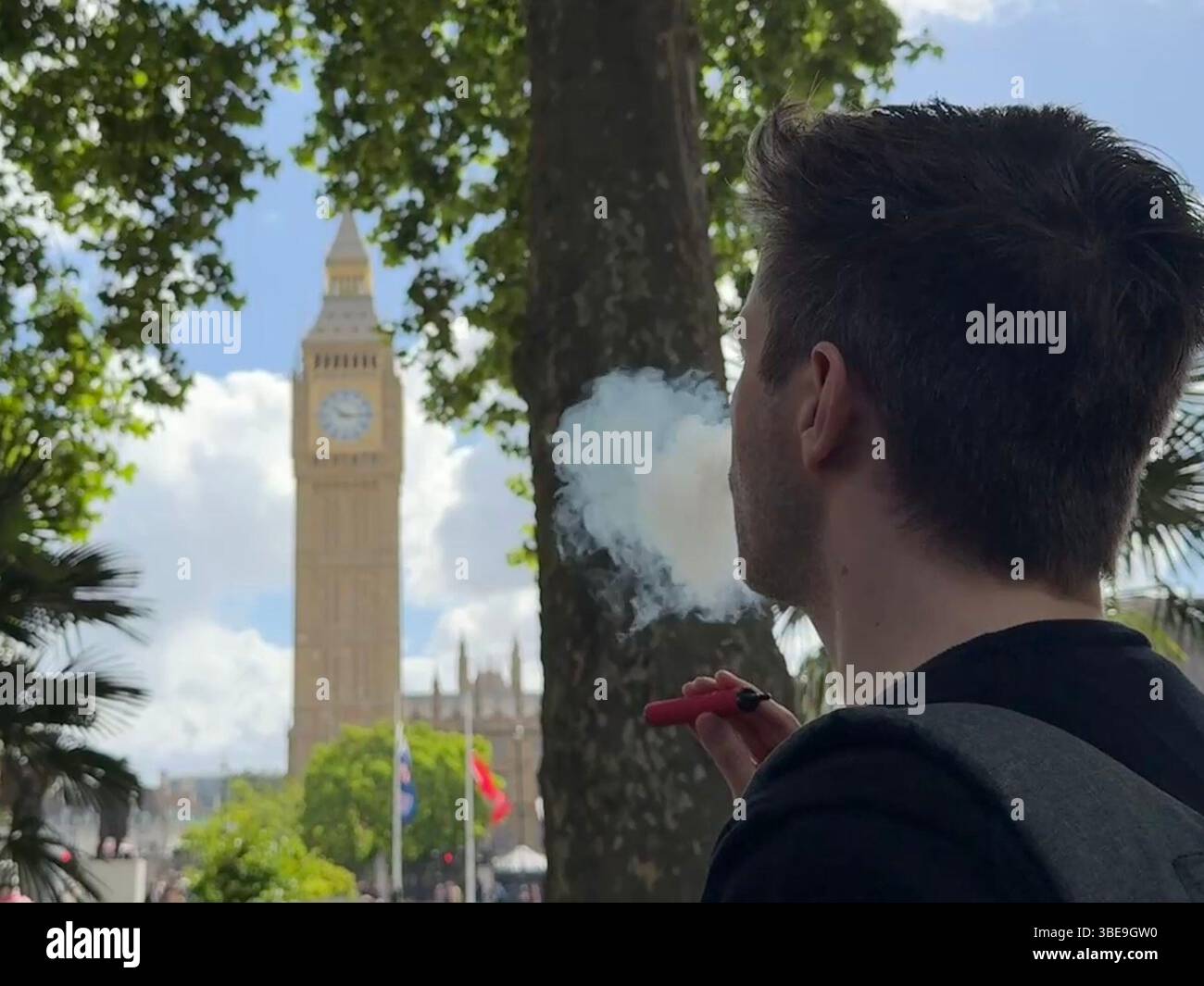 elf bar vape uk London, Germany. 28th May, 2025. A man uses a disposable vape, the  Elizabeth Tower (Big Ben) can be seen in the background. (to dpa 