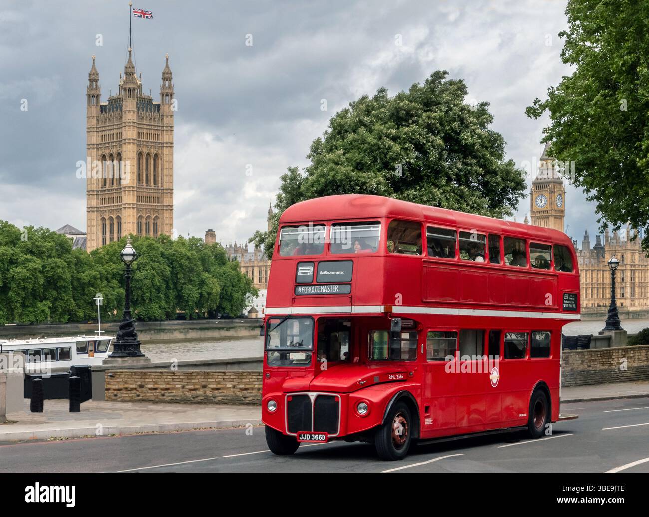 Classic AEC Routemaster London Bus passing the Houses of Parliament ...