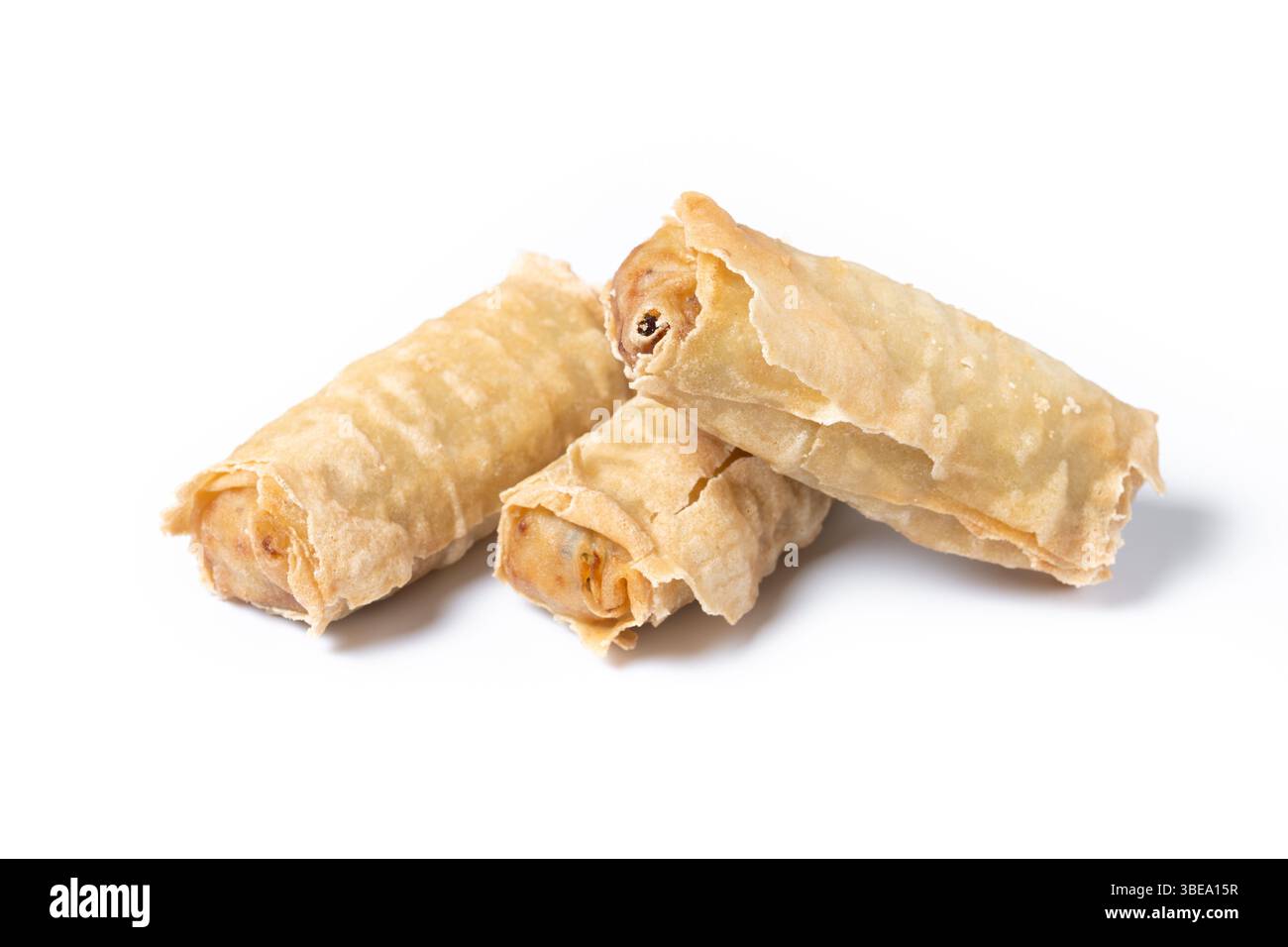 Crispy vegetables spring Rolls on Ceramic Plate isolated on white background Stock Photo