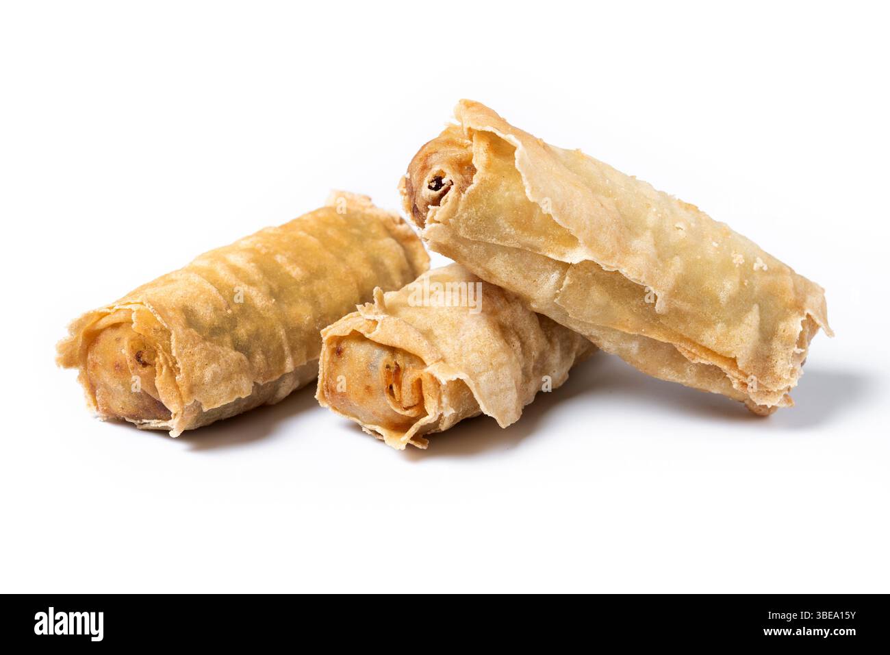 Crispy vegetables spring Rolls on Ceramic Plate isolated on white background Stock Photo