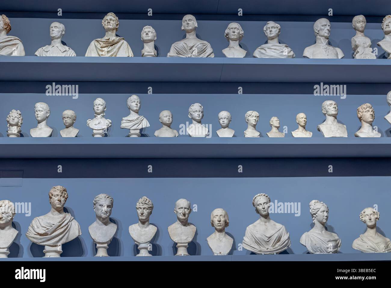 Plaster busts on shelves in the Gipsoteca Bartolini inside the Galleria dell’Accademia di Firenze,Florence,Italy Stock Photo