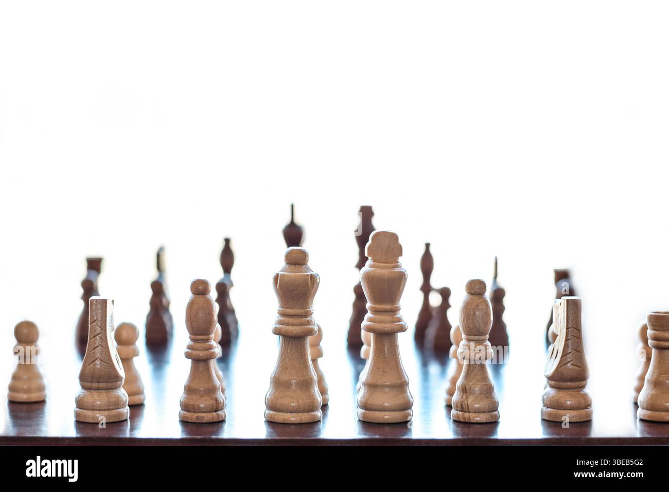 Wooden board with chess game on white background Stock Photo
