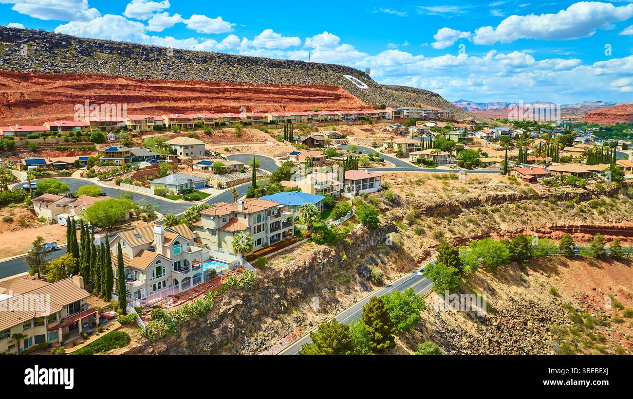 Suburban Rocks Aerial Suburban Homes and Red Rock Cliffs in Desert Landscape Fly Over ...