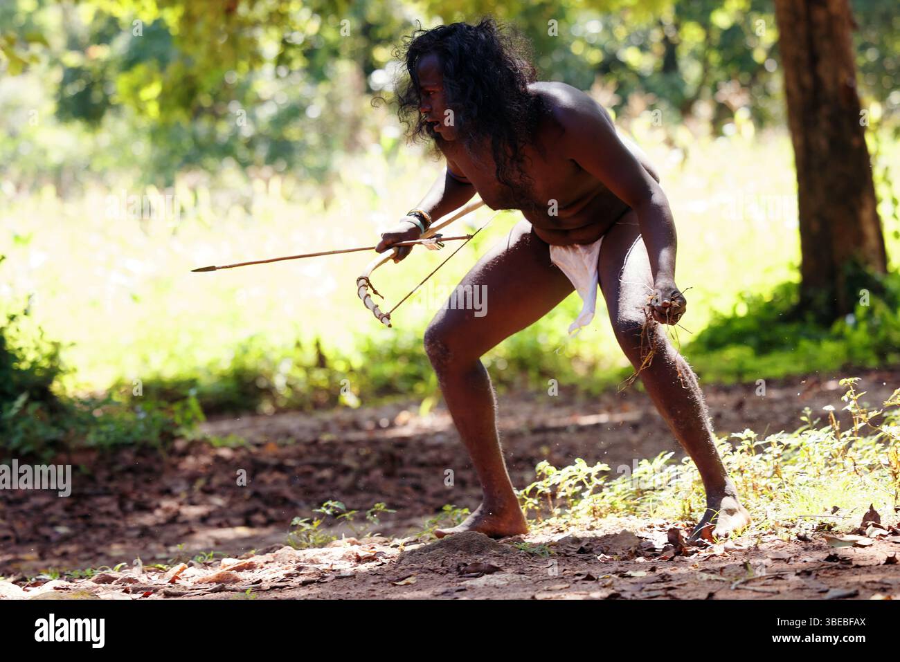 Vedda Language Vedda tribesman of Sri Lanka Hunting in the jungle with a bow and arrow ...