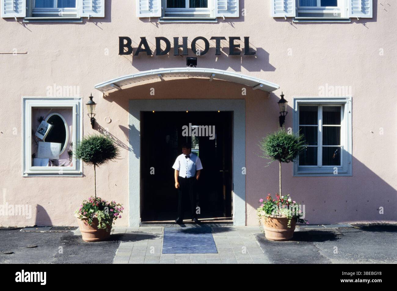 A man in front of the Badhotel (not a Bad Hotel) in Uberlingen, Germany Stock Photo