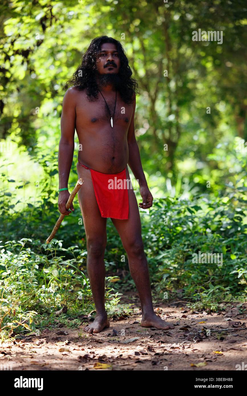 Vedda Language Vedda tribesman of Sri Lanka stands in natural surroundings ...