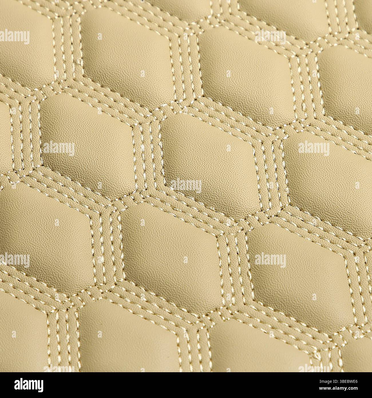 Texture of beige leather background with square pattern and stitch, macro Stock Photo