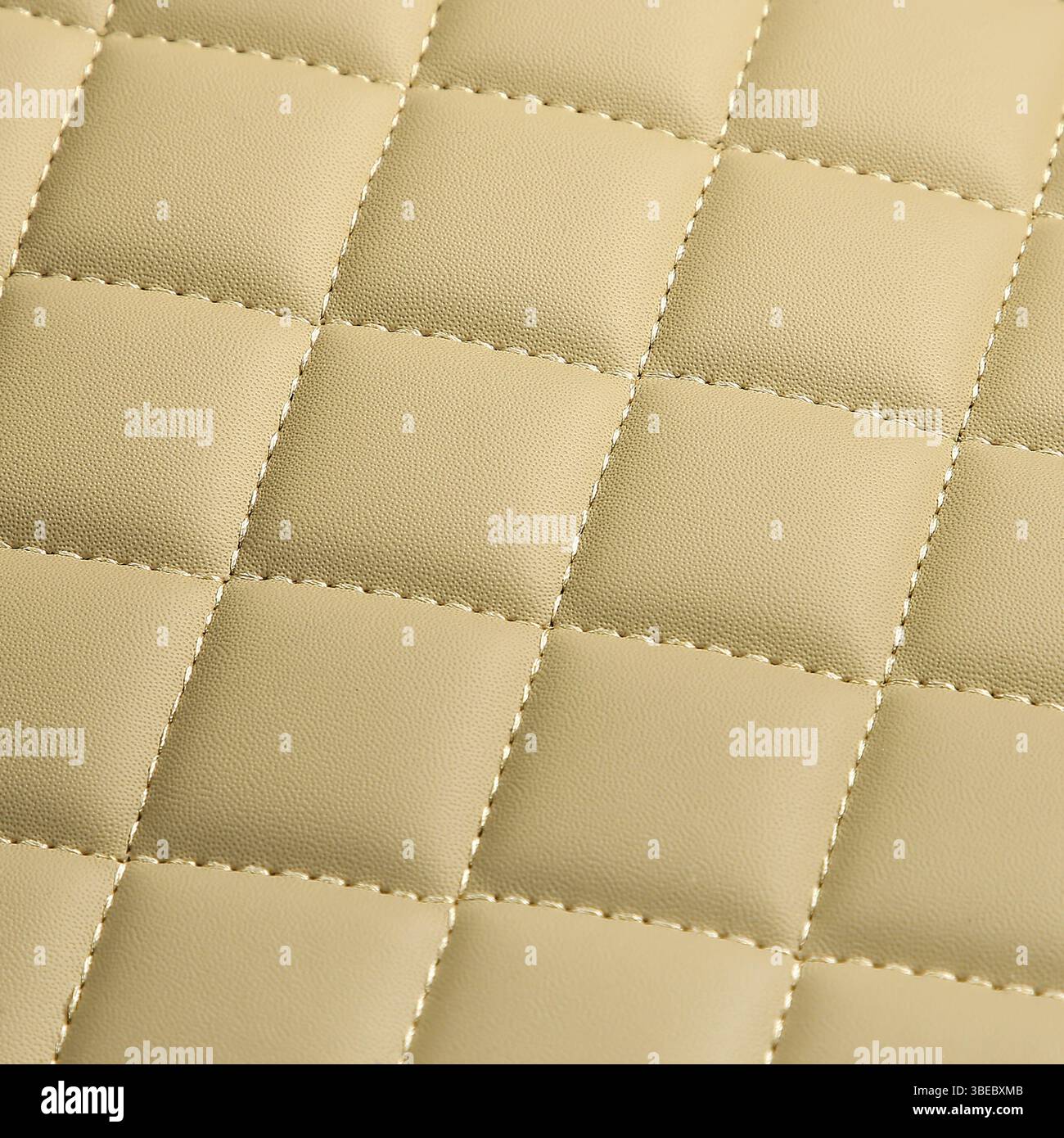 Texture of beige leather background with square pattern and stitch, macro Stock Photo