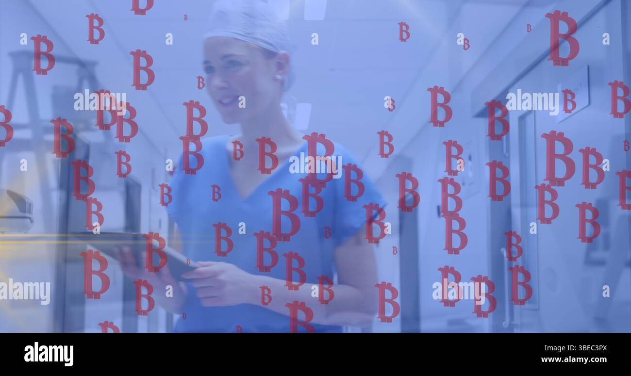 Image of bitcoins sings failing over caucasian female doctor Stock Photo