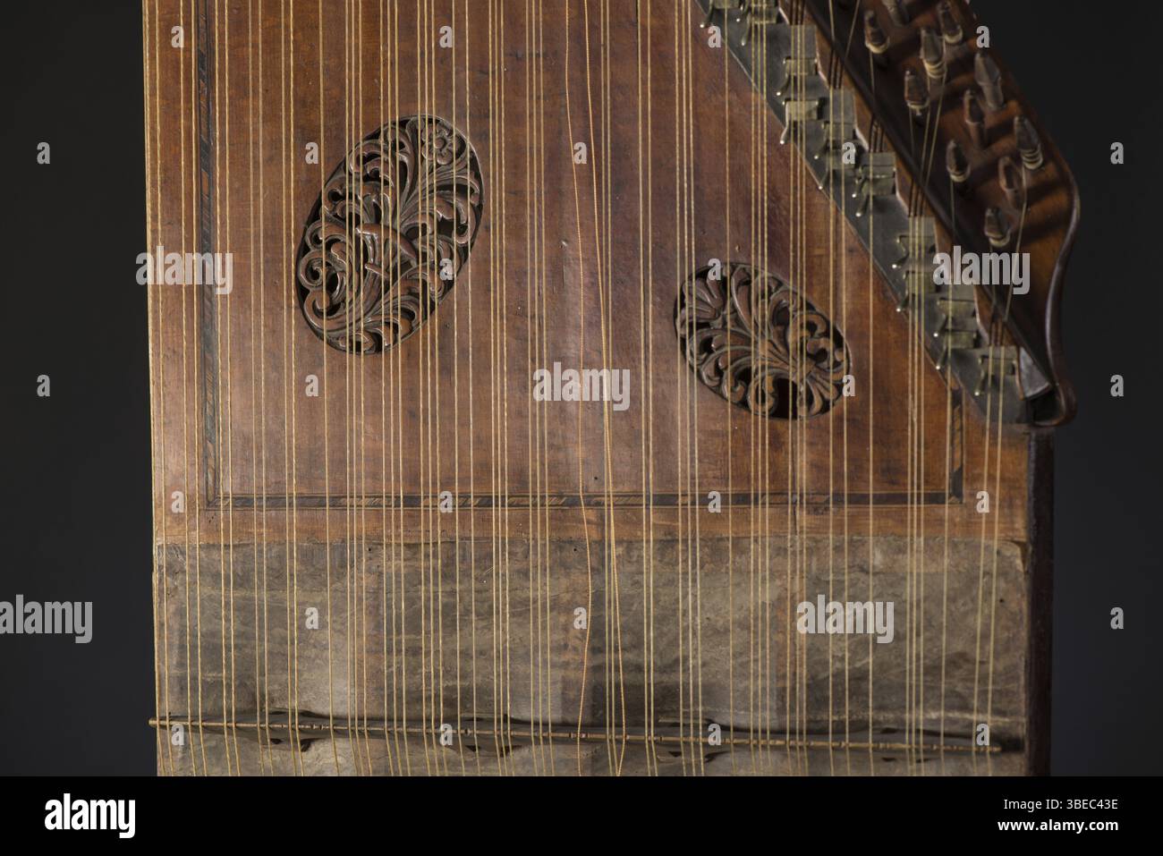 Ancient Asian stringed musical instrument on black background with ...