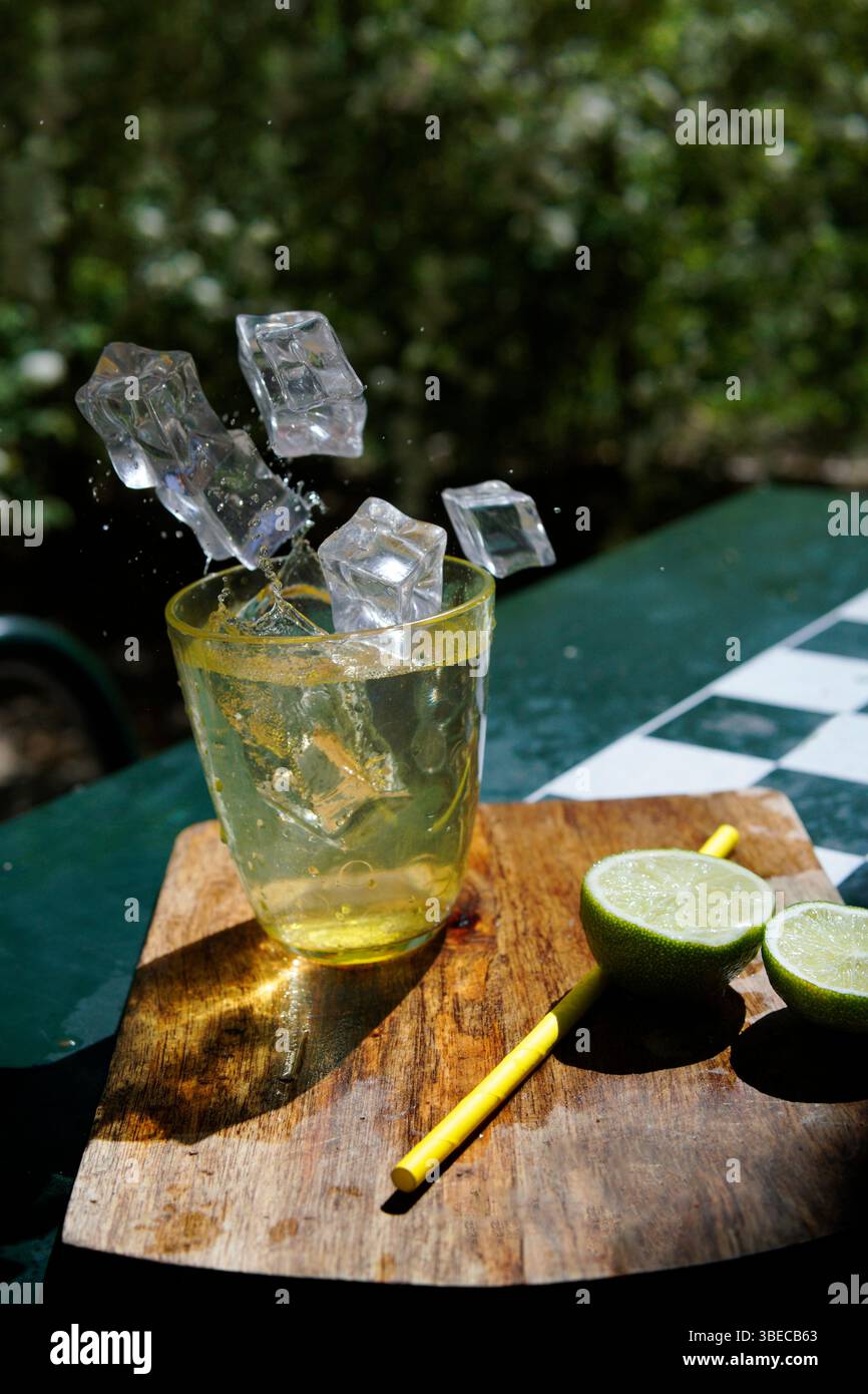 ice cubes falling into glass Stock Photo