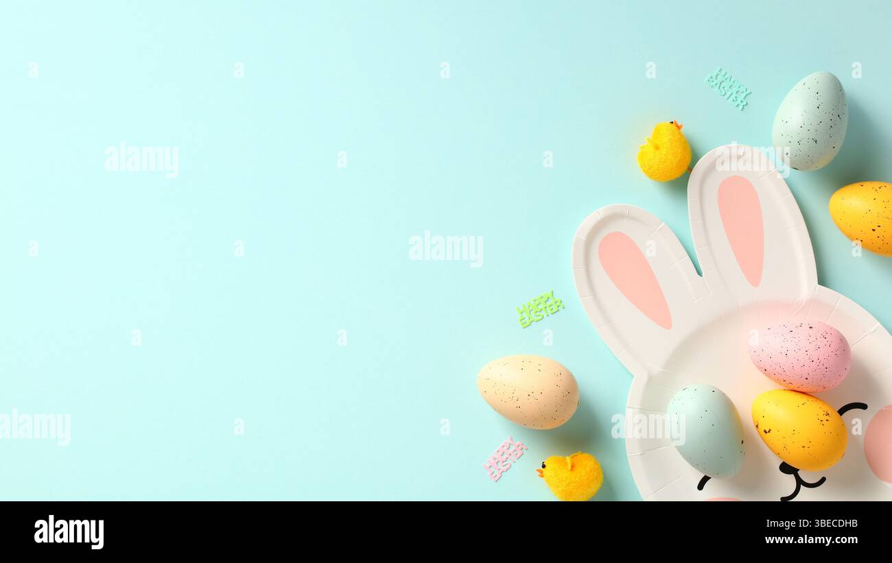 Happy Easter banner. Easter eggs and plate in form of Easter bunny on blue background. Stock Photo