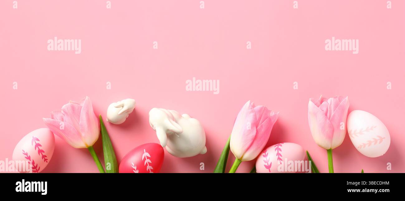 Happy Easter banner design with tulips, Easter eggs, decorative bunnies on pink background. Stock Photo
