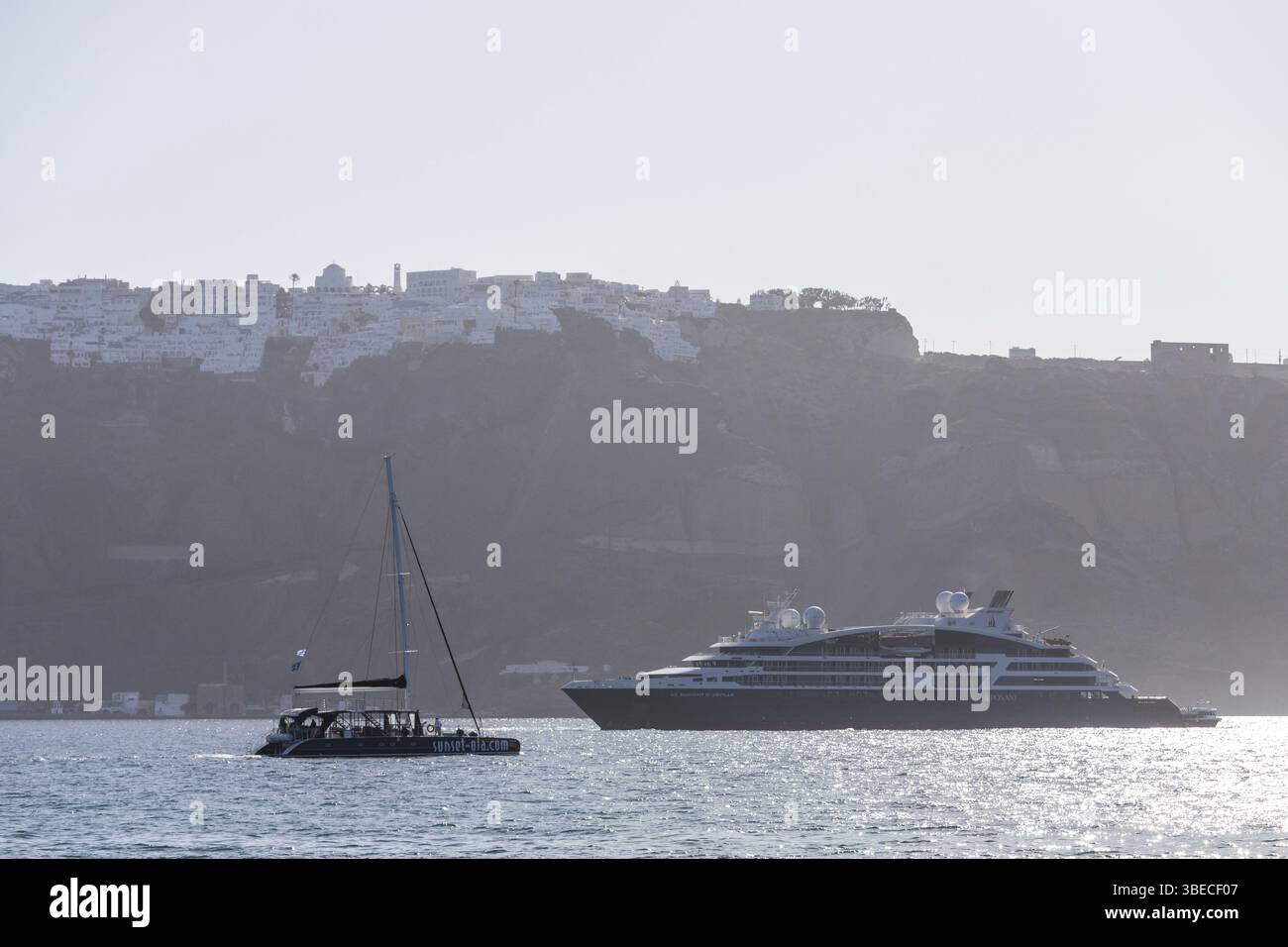 Cruise ship and catamaran in the caldera, archipelago of Santorini, Cyclades, Greece, Europe Stock Photo