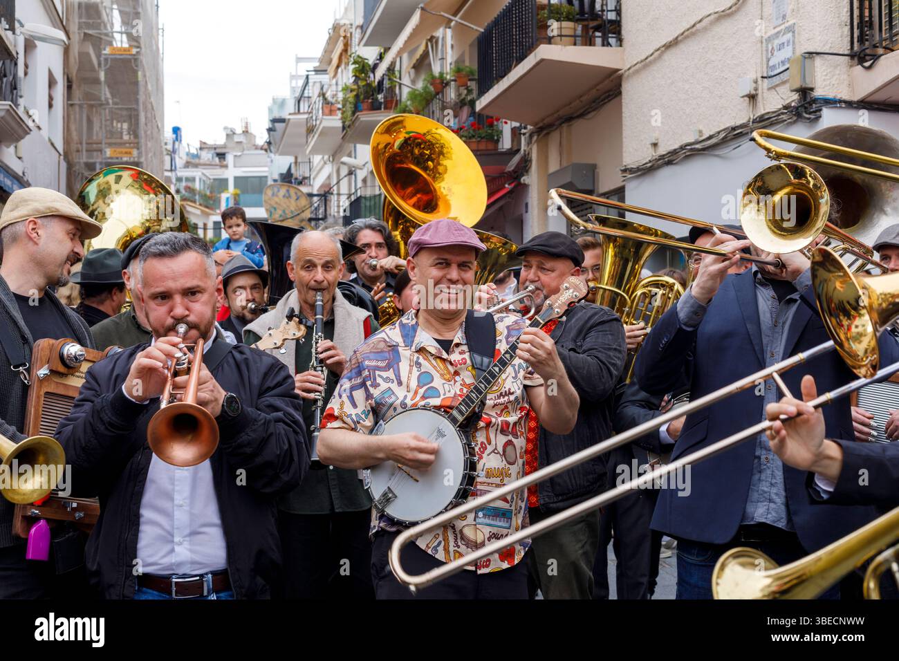 Spain, Sitges, Sitges Jazz Festival, musicians playing instruments in the a street parade Stock Photo