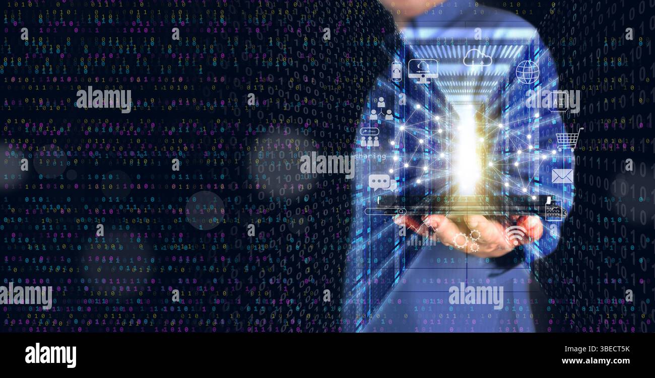 Digital technology and cloud computing concept: A man using a tablet to connect to an online data server to create, store, process, and communicate in Stock Photo