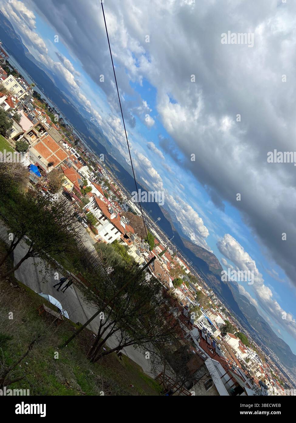 cityscape, mountains, cable car, wires, cloudy sky, urban view, Turkey, scenic, residential buildings, landscape, nature and city, skyline, rooftops, - Smartphone Captured Stock Image