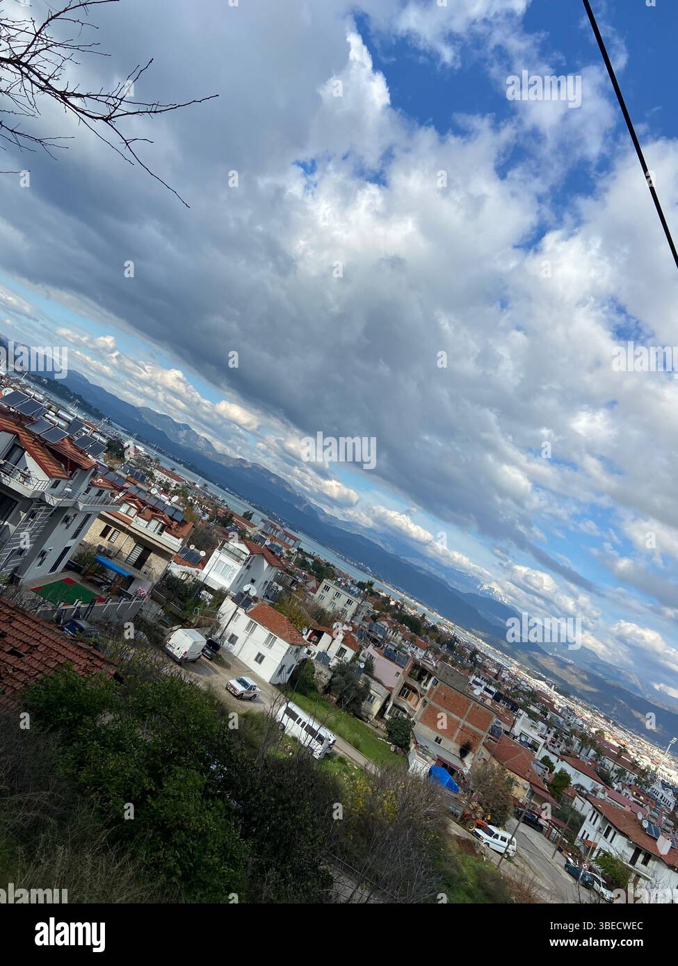 Panoramic view of a cityscape with residential buildings and a cloudy sky in Turkey. - Smartphone Captured Stock Image Panoramic view of a cityscape with residential buildings and a cloudy sky in Turkey. - Smartphone Captured Stock Image
