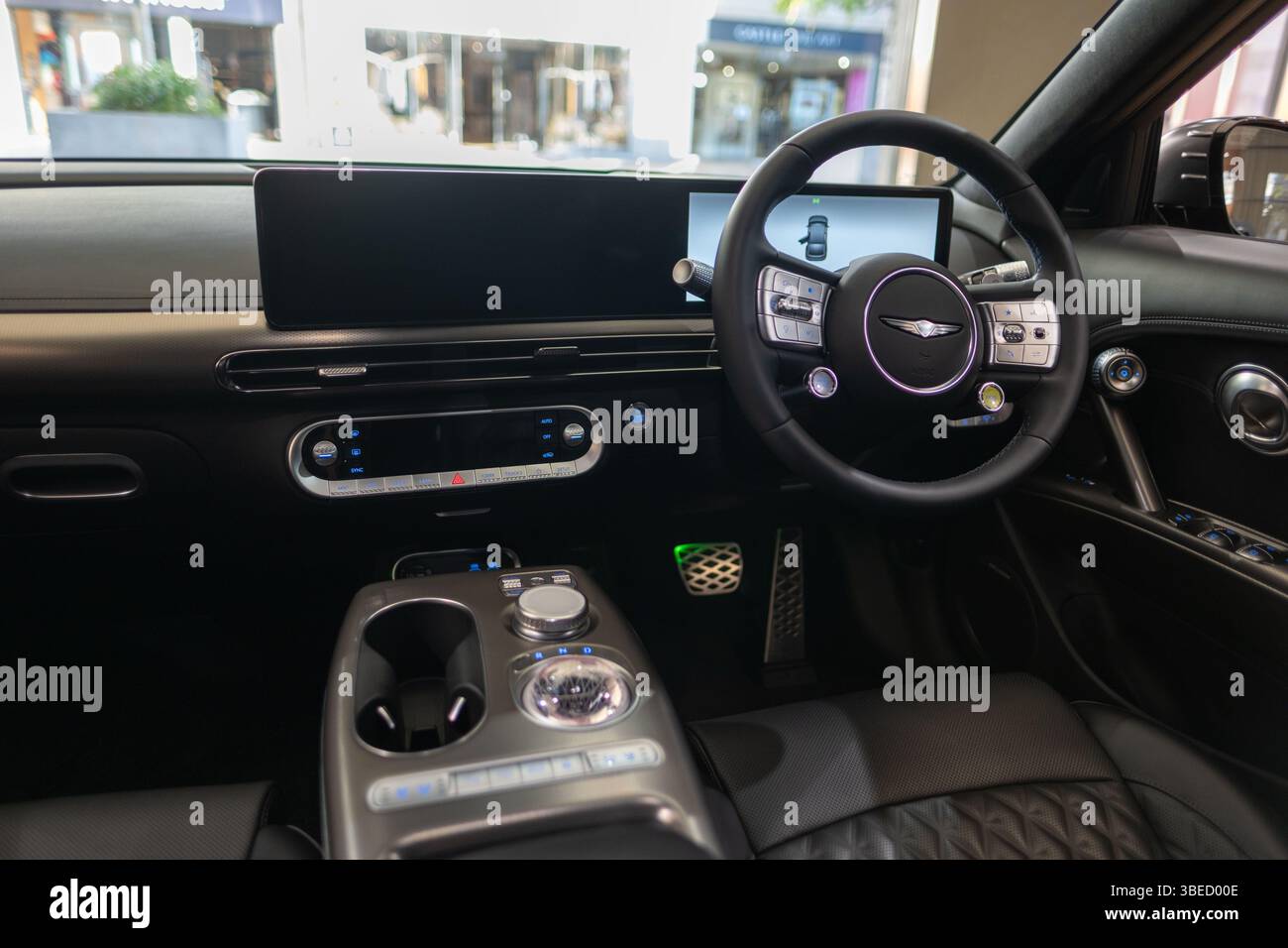 left-hand all-electric Hyundai Genesis GV60 car interior, steering ...