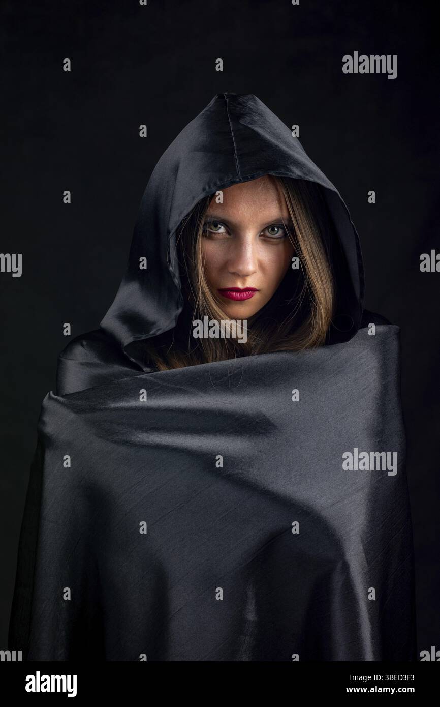 Black silk cloak hi-res stock photography and images - Alamy