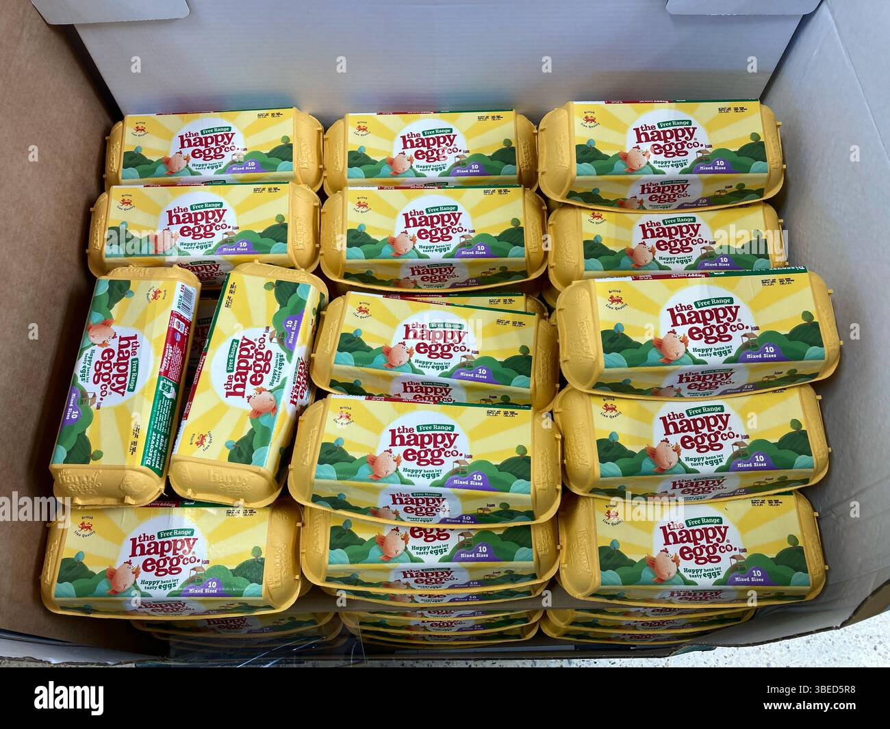 The Free Range Happy Egg boxes of 10 eggs for sale at the supermarket, UK Stock Photo