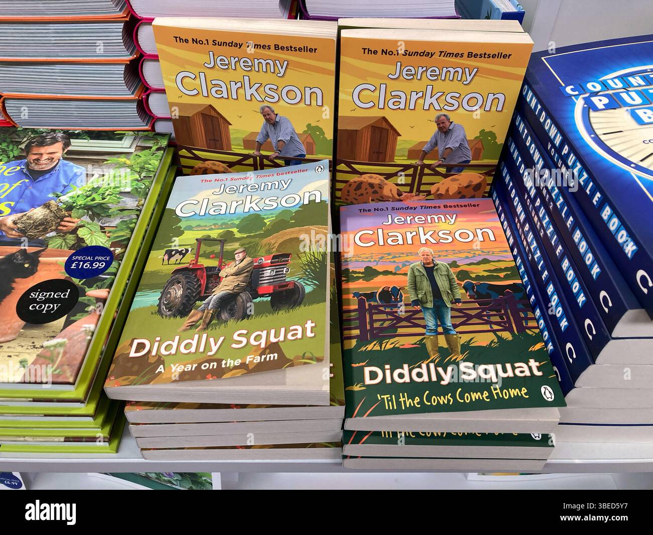 Jeremy Clarkson, Diddly Squat farm, Clarkson's Farm books for sale at the local book shop - Smartphone Captured Stock Image