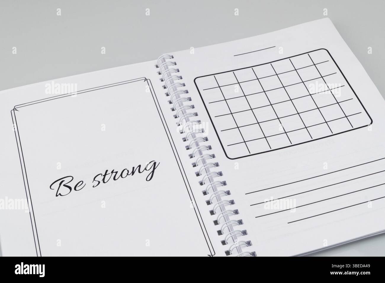Open notepad with markup on a white background Stock Photo