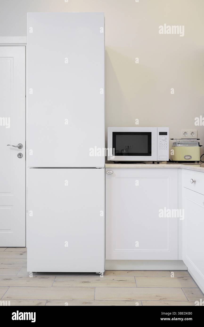 White refrigerator and microwave in the kitchen Stock Photo