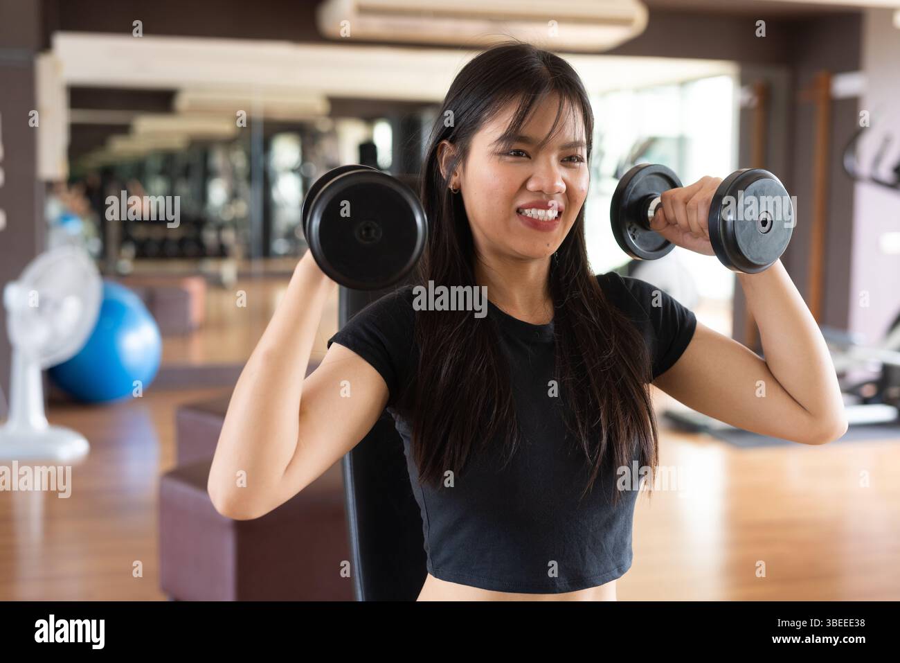 Young beautiful Asian fitness woman exercising in gym Stock Photo - Alamy