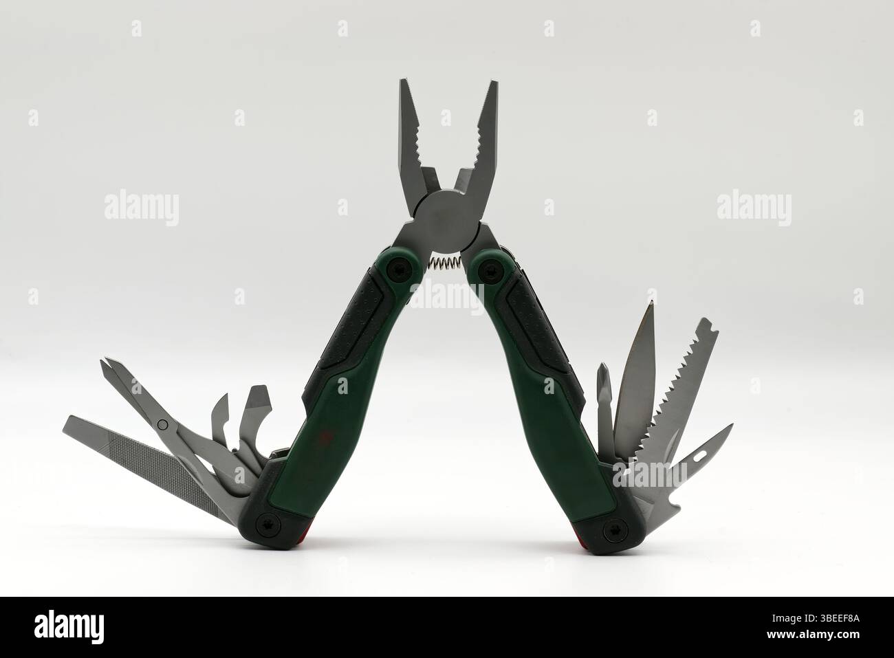 Multi tool with multiple functions and pliers isolated on white background. Stock Photo