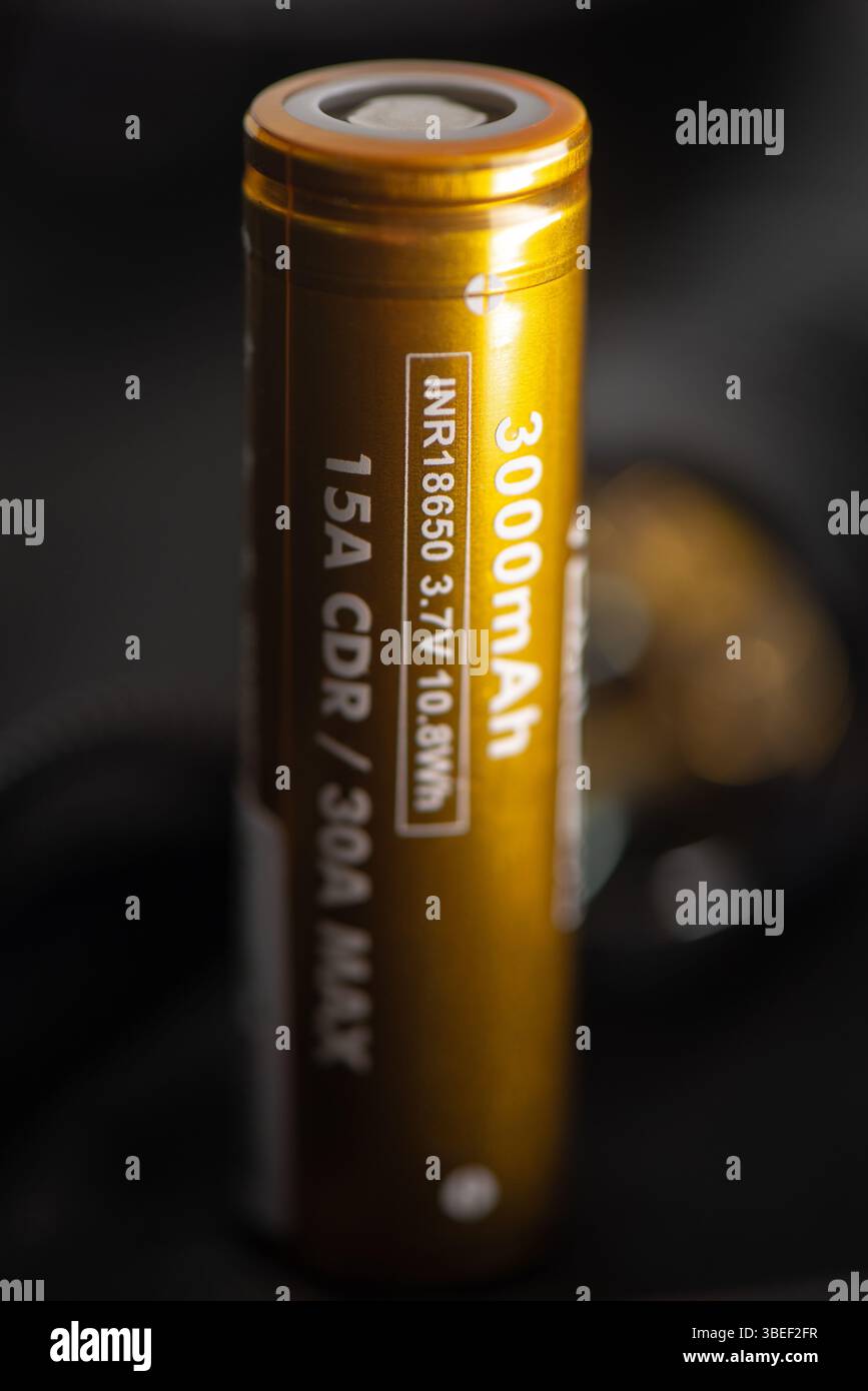 The golden INR18650 3.7V rechargeable battery. INR18650 battery is Lithium nickel rechargeable battery with size 18mm by 65mm. Stock Photo