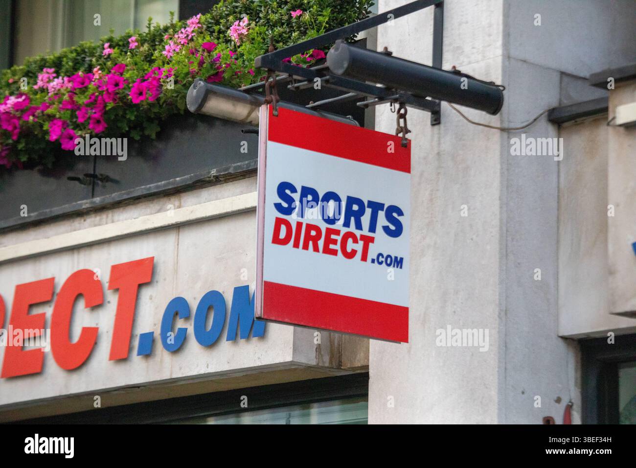 A Sports Direct sign hangs outside a store in London, showcasing the ...