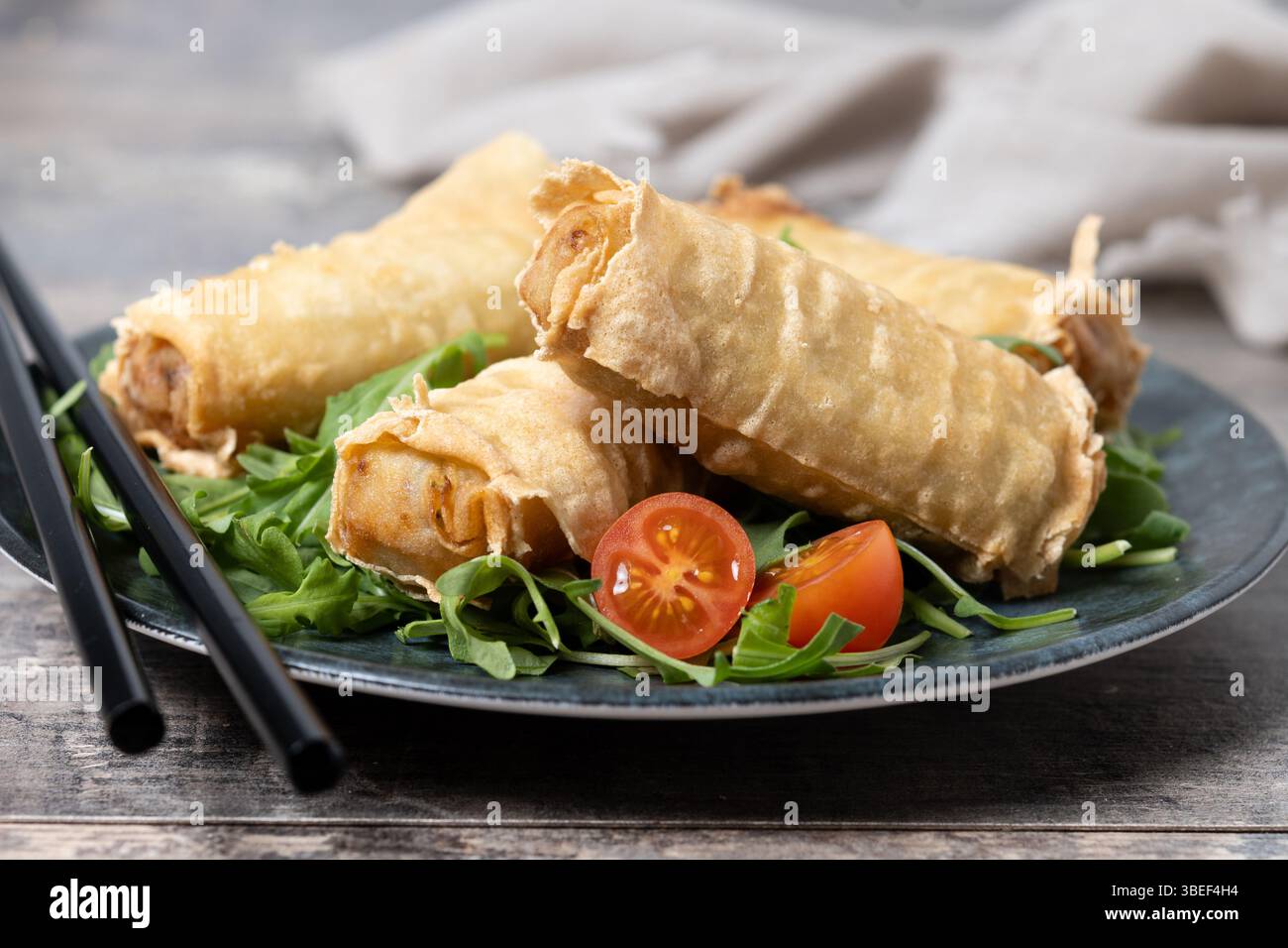 Crispy vegetables spring Rolls on wooden table Stock Photo