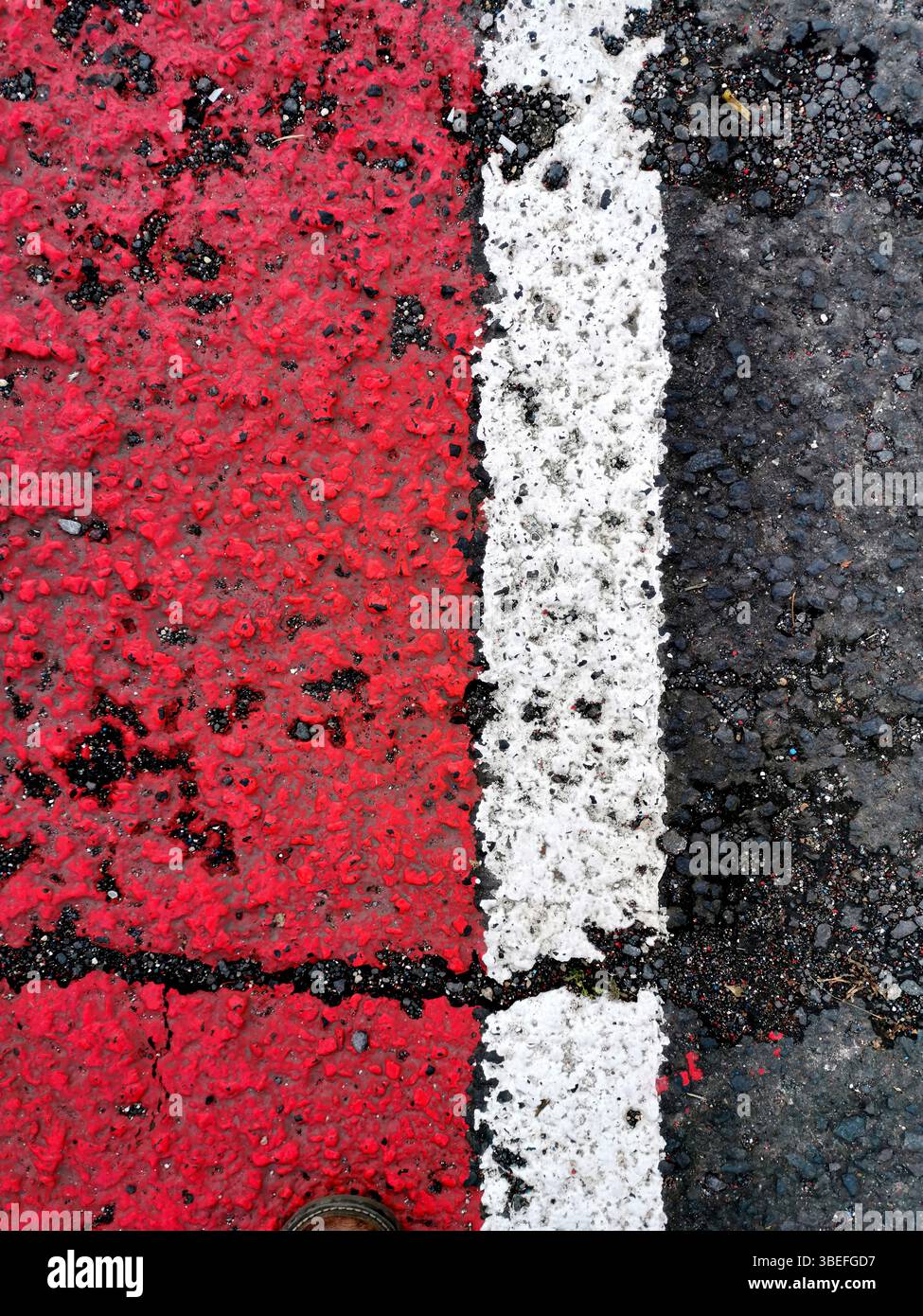 Bright red and white lines mark the asphalt surface, showcasing a clear ...