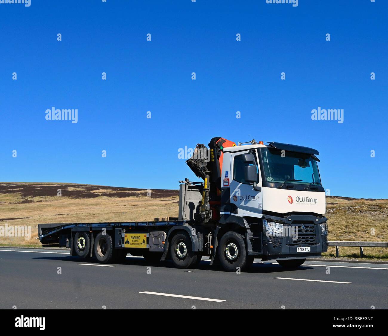 OCU Group Limited HGV, travelling at speed on the M6 Motorway Southbound carriageway, Shap, Cumbria, England, United Kingdom, Europe. Stock Photo