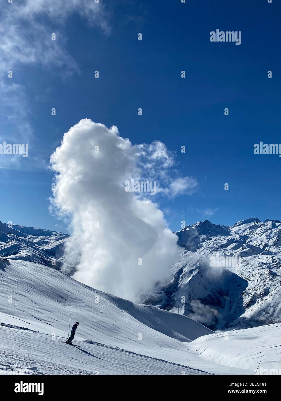 Touching the sky — where snowy peaks meet drifting clouds and solitude feels infinite. - Smartphone Captured Stock Image