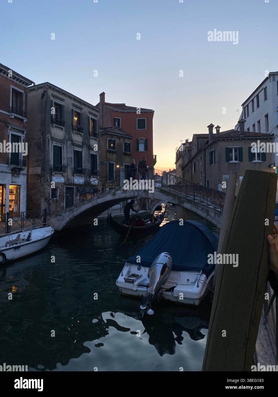 Golden hour in Venice — where gondolas glide beneath timeless bridges and the city begins to glow. - Smartphone Captured Stock Image