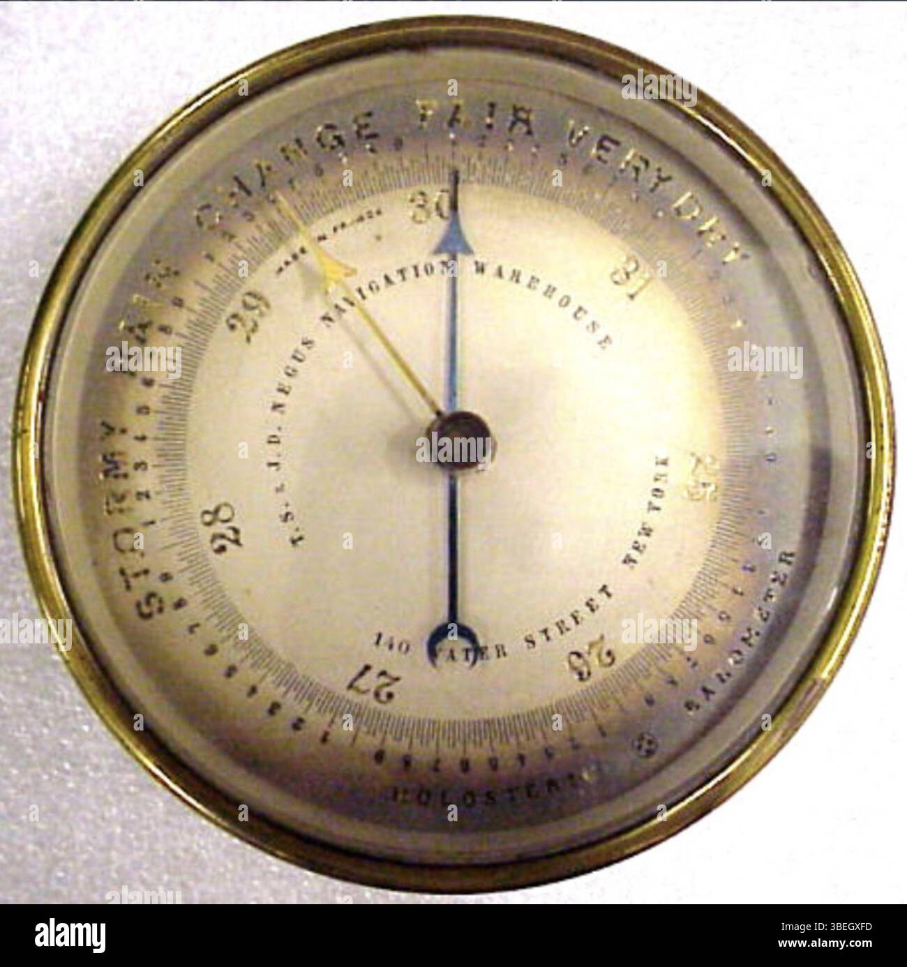 This brass aneroid barometer was made by T.S. & J.D. Negus in 1900. It ...
