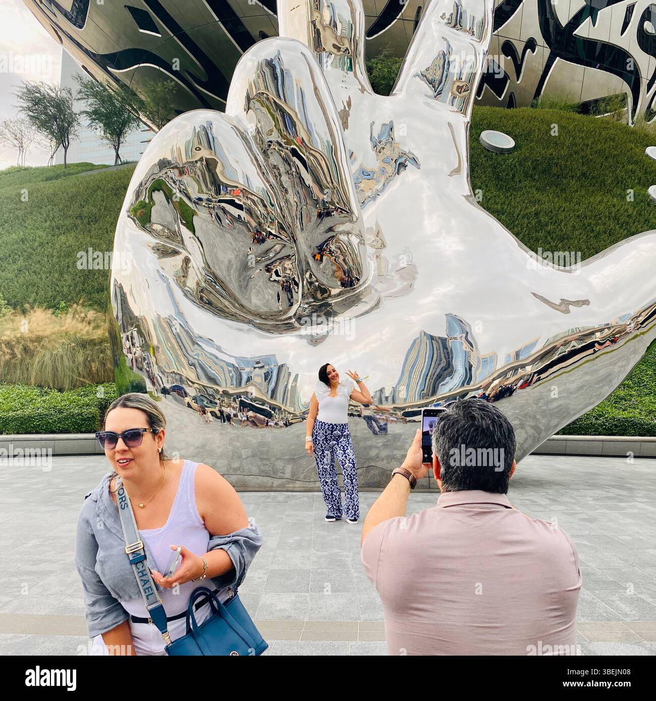 Tourist photographing at the Museum of the Future Dubai - Smartphone Captured Stock Image