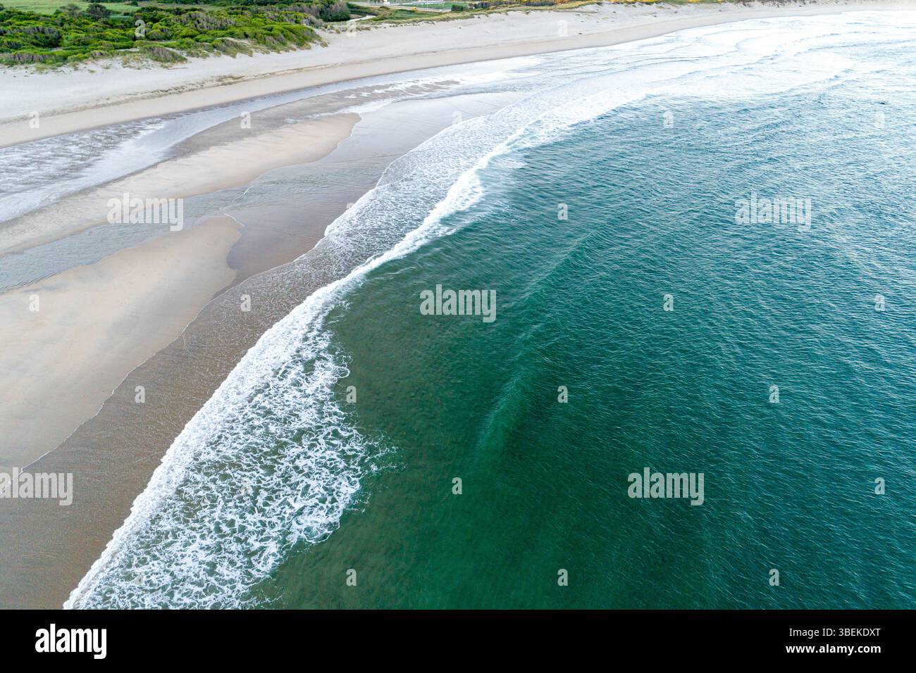 seascape panorama a peaceful beach and ocean with subtle wave patterns ...