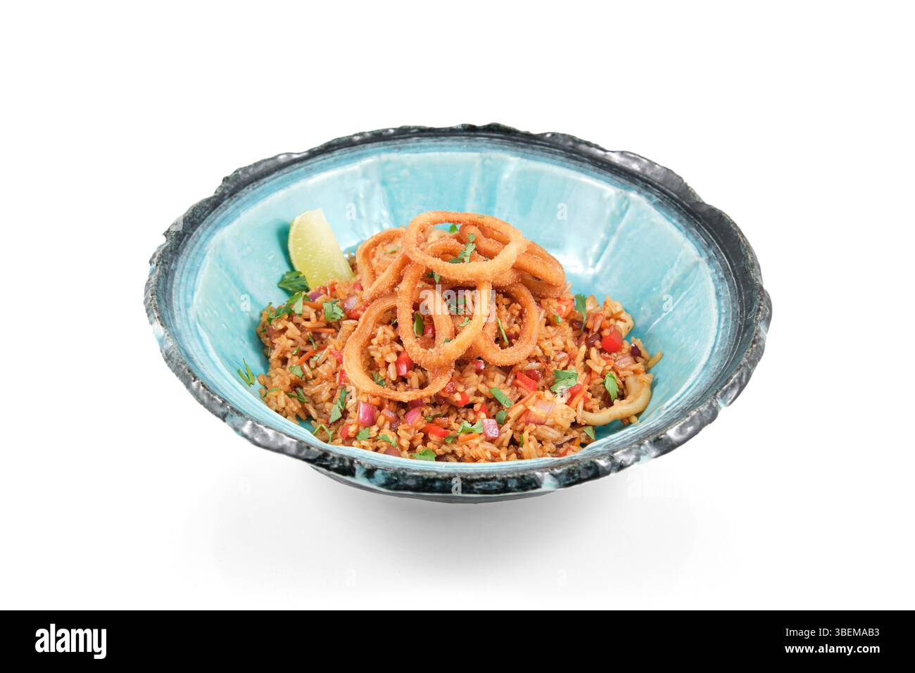 Serving of appetizing fried rice with calamari, vegetables, and crispy ...