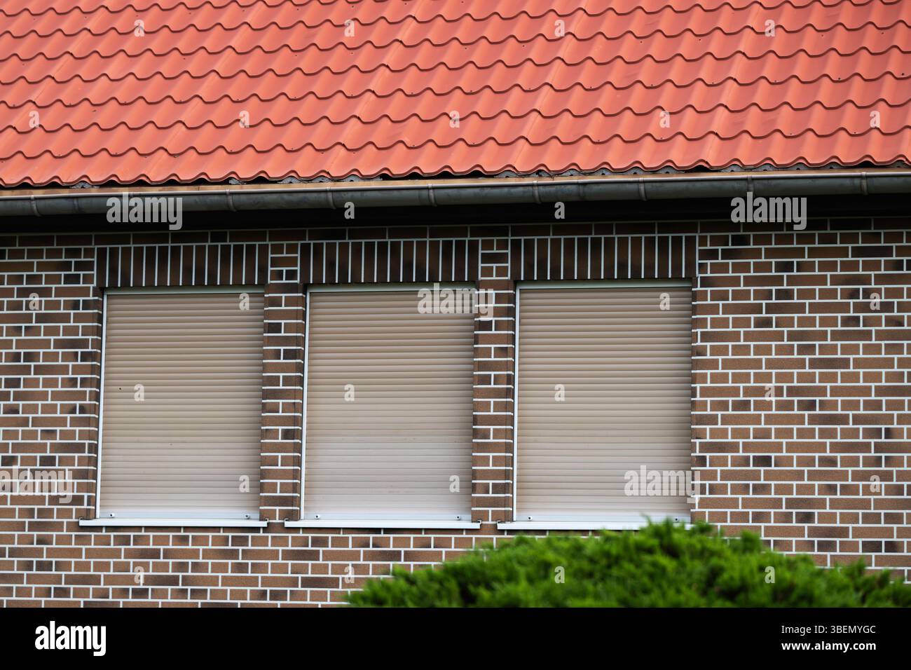 Brown roller shutters on a house Stock Photo