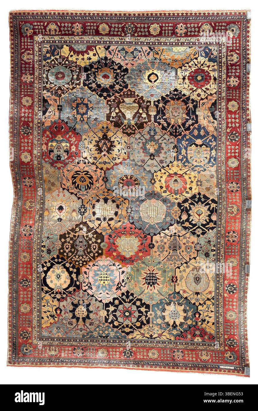 This Kum Kapi rug, woven with silk and metal threads around 1910 by Hagop Kapoudjian, features intricate designs typical of the era. The rug reflects the fine craftsmanship and artistic traditions of Ottoman textile artistry. Stock Photo